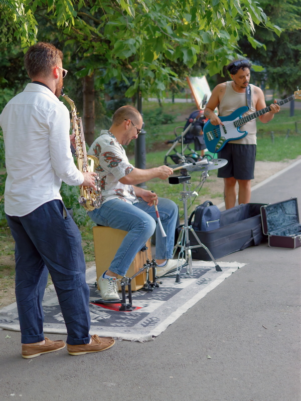 27 - A three-piece street band called POMATO, performing live in Cișmigiu Gardens.